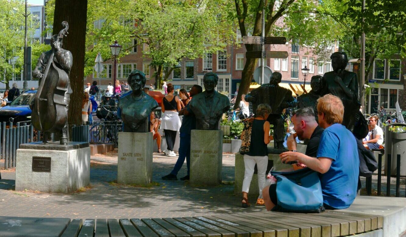 The Netherlands People outside on benches Elandsgracht Amsterdam Fons Heijnsbroek The Netherlands People outside on benches Elandsgracht Amsterdam Fons Heijnsbroek